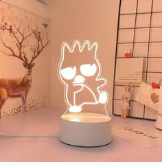 a lamp that has a cartoon character on it in the shape of a cat with glasses