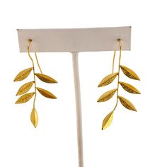 Elegant gold plated leaf drop earrings measuring 2" by 1". These lightweight, textured earrings make a beautiful statement and add a touch of nature-inspired beauty to your look. * Gold plated metal * Leaf drop design * Light and airy * Textured finish * Statement earrings * Size: 2" by 1" Features: * Leaf, Drop Size: Womens 2" by 1" Condition: Pre-Owned Good Gold Leaf-shaped Nature-inspired Earrings, Gold Leaf Nature-inspired Earrings, Nature-inspired Gold Leaf-shaped Earrings, Nature-inspired Gold Leaf Earrings, Gold Nature-inspired Metal Earrings, Textured Earrings, Drop Earrings Gold, Drop Design, Metal Leaves