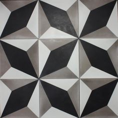 a black and white tile design on the floor