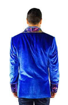 This mens royal blue velvet smoking jacket exudes a certain sophistication that other jackets can only dream of. We have taken this perfectly tailored,double breasted blazer to the next level with the addition of iridescent multi color flip sequins. FEATURES: Double breasted Fully lined with our signature satin 4 pockets including 1 inside breast pocket Reversible iridescent sequin contrast collar, cuffs and trim Velvet trimmed collar to for ultimate comfort Ethically made in-house in our studio Winter Party Blue Blazer, Blue Velvet Winter Outerwear, Royal Fitted Outerwear For Winter, Royal Fitted Winter Outerwear, Royal Blue Winter Outerwear, Fitted Royal Blue Winter Blazer, Royal Blue Long Sleeve Party Blazer, Royal Fitted Fall Outerwear, Blue Party Outerwear With Lapel Collar