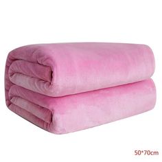 two pink blankets folded on top of each other