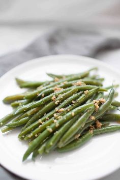 green beans with seasoning on a white plate