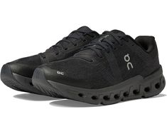 the on cloud running shoe is black and has an upper part with holes in it