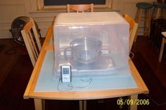 a microwave oven sitting on top of a wooden table