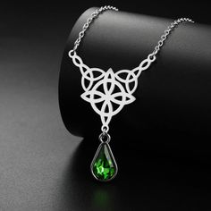 ⚜️Looking for a stunning piece of jewelry that exudes both style and spirituality? Look no further than our Celtics Knot Necklace! Crafted with Stainless Steel and adorned with a mesmerizing Crystal Rhinestone, this necklace will add a touch of magic to any outfit. Complete with an elegant pendant size of 32.5*27.9mm, it's the perfect accessory for any witch or crystal lover. Add it to your collection today and let its powerful energy guide you on your journey! ✨🔮 May Birthstone Crystal Jewelry Gift, Crystal Jewelry For May Birthstone Gift, Crystal Jewelry Gift For May Birthstone, Spiritual Round Pendant Clavicle Chain Jewelry, Spiritual Jewelry With Round Pendant Clavicle Chain, Spiritual Jewelry With Clavicle Chain And Round Pendant, Spiritual Gemstone Metal Jewelry, Spiritual Clavicle Chain Jewelry With Round Pendant, Spiritual Crystal Jewelry Gift