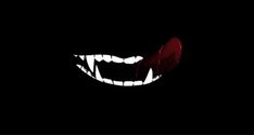 an evil looking face in the dark with its mouth open and teeth wide open,