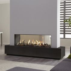 a modern fireplace in the middle of a living room