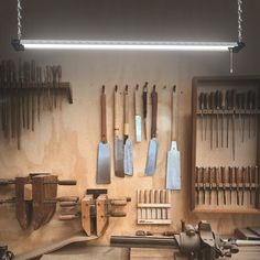 an assortment of tools are displayed on the wall