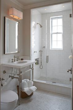 a bathroom with a sink, toilet and shower