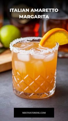 a close up of a drink in a glass with an orange slice on the rim