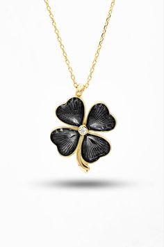 Clover necklace 14K Gold This Leaf 14k Gold Necklace is a beautiful accessory that will bring out the delicate beauty in you. This lovely necklace is crafted with care and precision, designed with a clover-shaped pendant and handcrafted with a delicate 14k gold chain. It has a graceful look that will make heads turn, and bring out your inner radiance. The chain of this exquisite necklace is strong and durable - it won't easily break or snag, so you can wear it for years to come. The small clover Elegant 14k Gold Necklaces For Good Luck, Elegant 14k Gold Necklace For Good Luck, Yellow Gold Necklaces With Black Enamel For Gift, Elegant Tarnish Resistant Jewelry For Good Luck, Gold Jewelry With Black Enamel For Anniversary, Black Pendant Necklace For Mother's Day, 14k Gold Necklace With Black Enamel For Gift, 14k Gold Flower Pendant Necklace For Gift, 14k Gold Flower Pendant Necklace As Gift