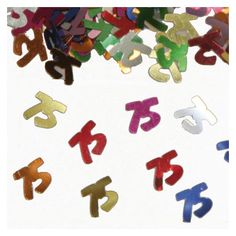 multicolored plastic numbers are scattered on a white surface