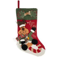 a christmas stocking with a dog and stockings hanging from it's side on a white background