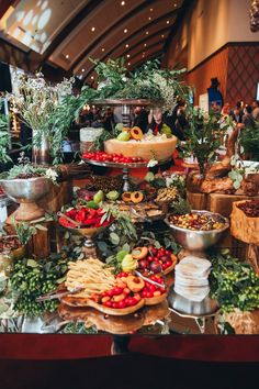 a buffet table filled with lots of food