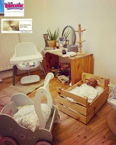 a baby's room with toys and other items on the floor