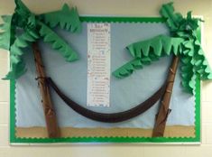 a bulletin board with palm trees and a hammock hanging from it's sides