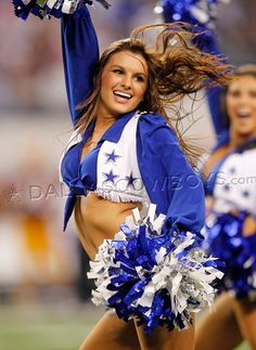 a cheerleader is dancing on the field