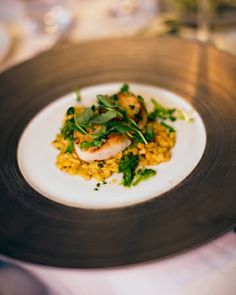 a white plate topped with food on top of a table