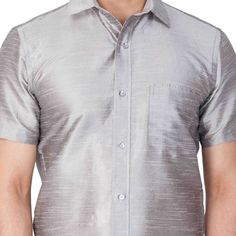 VM By VASTRAMAY Men's Grey Silk Blend Ethnic Shirt Elevate your ethnic wear collection with this classic VM By VASTRAMAY shirt. Crafted from a luxurious silk blend, this shirt offers a comfortable and stylish drape. Pair it with your favorite trousers or jeans for a perfect evening look. Key Features Grey solid ethnic shirt Shirt collar Full button placket One patch pocket Short regular sleeves Straight hem Specifications Sleeve Length: Short Top Shape: Straight Top Hemline: Straight Top Length: