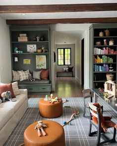 a living room filled with furniture and bookshelves