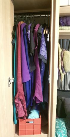 the closet is full of clothes and other items