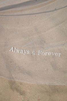 the words always and forever are etched in sand