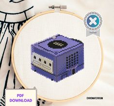 a cross stitch pattern with a purple box on it