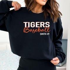 This sweatshirt is the perfect choice for school, sports, and lounging around. Its medium-heavy fabric delivers a cozy, warm feeling while each sweatshirt runs true-to-size for a great fit. An all around great choice for teams, players & their biggest fans. CUSTOMIZE Available to customize with your team name, team colors & your choice of player details on the front (optional). You can also choose between the cursive & sporty font for baseball. This design is printed directly onto the sweatshirt Team Mom Shirt, Team Mom Baseball, Softball Sweatshirt, Swag Shirts, Baseball Shirt Designs, Baseball Apparel, Baseball Team Shirt, Custom Baseball Shirt, Custom Softball