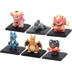 the pokemon figurines are lined up on black bases with different colors and shapes