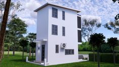 a white two story house sitting on top of a lush green field