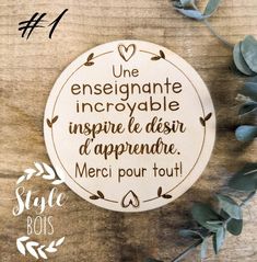 a wooden plaque that says, une enesignne incroyble inspire desir d'apprenire merci pour tout