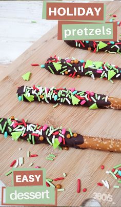 holiday pretzels with chocolate and sprinkles on a wooden cutting board