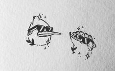 two black and white drawings of birds on paper