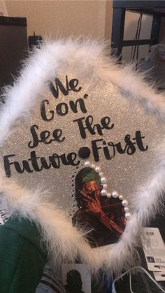 a graduation cap that says we gon see the future first