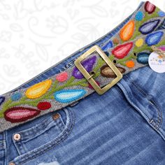 Step into a world of vibrant colors and exquisite craftsmanship with our handcrafted wool embroidery belt. Each belt is meticulously embroidered by skilled artisans using high-quality sheep wool, ensuring a one-of-a-kind piece that reflects the rich cultural heritage of the Andes. The vibrant colors are achieved using natural dyes derived from plants, flowers, and other organic sources, making each piece environmentally friendly and unique. Whether you're dressing up a casual outfit or adding a splash of color to your favorite dress, this wool embroidery belt is the perfect versatile accessory. Specifications: -Material: 100% Sheep Wool -Dyes: Natural, eco-friendly dyes -Size: Varies (please check individual product listings for specific measurements) -Origin: Handcrafted in Ayacucho - Per Folk Style Multicolor Embroidered Belt, Folk Multicolor Embroidered Belt, Folk Style Multicolor Fabric Belt, Artisan Multicolor Fabric Belt, Multicolor Fabric Belt In Folk Style, Multicolor Folk Fabric Belt, Bohemian Multicolor Embroidered Belt, Embroidered Belts, Colorful Belt