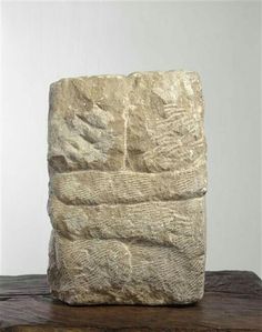 a stone block sitting on top of a wooden table