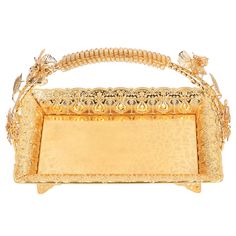 an ornate gold tray with flowers and leaves on the sides, set against a white background