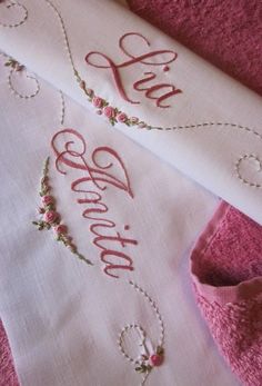 two embroidered cloths with the word love on them