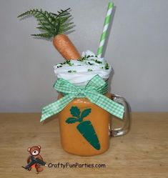 a glass mug with carrots and whipped cream in it