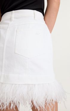 Effortlessly chic and versatile, our Luca skirt is a must-have addition to any wardrobe. This mini denim skirt features a crisp white hue and a playful feather hem for a touch of whimsy. The zipper fly and button closure ensure a perfect fit every time. Elevate your style with the Luca skirt. Details Zipper fly and button closureFabric: White DenimMid riseFeather hem detail Mini length Content and Care 75% Cotton 24% Polyester 1% ElastaneDry CleanImported Measurements 13.5in/34.29cm from top edg Skirt Details, Mini Denim Skirt, Denim Chic, High Hips, Parisian Chic, White Denim, Denim Skirt, Perfect Fit, Zipper