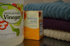 a can of baking soda next to some folded towels and a bottle of baking soap