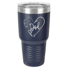 a blue tumbler with the word dad written on it and a heart shaped stethoscope