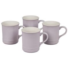 four white coffee mugs sitting next to each other