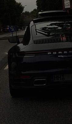 the back end of a black sports car