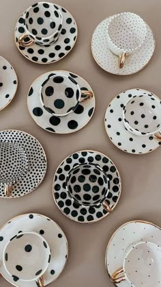 black and white plates with polka dots on them are arranged in a gridded pattern