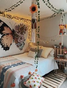 a bedroom decorated with flowers and string lights