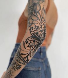 a woman with a tattoo on her arm