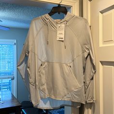 Nwt, Athleta Teton Anorak Jacket, Size Small. Light Grey Color. Light Weight With Hood, Water Repellent Jacket. Athleisure Sports Hoodie With Pockets, Sports Athleisure Hoodie With Pockets, Long Sleeve Activewear With Pockets For Gym, Long Sleeve Gym Activewear With Pockets, Stretch Outerwear With Pockets For Sports, Stretch Sports Outerwear With Pockets, Stretch Hooded Track Jacket With Pockets, Functional Sports Sweatshirt With Pockets, Sports Long Sleeve Tops With Pockets