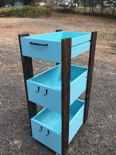 an old dresser is painted blue and has three drawers on the bottom, one with two handles