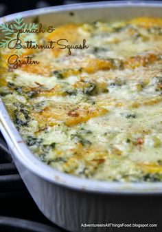 a casserole dish filled with cheese and spinach